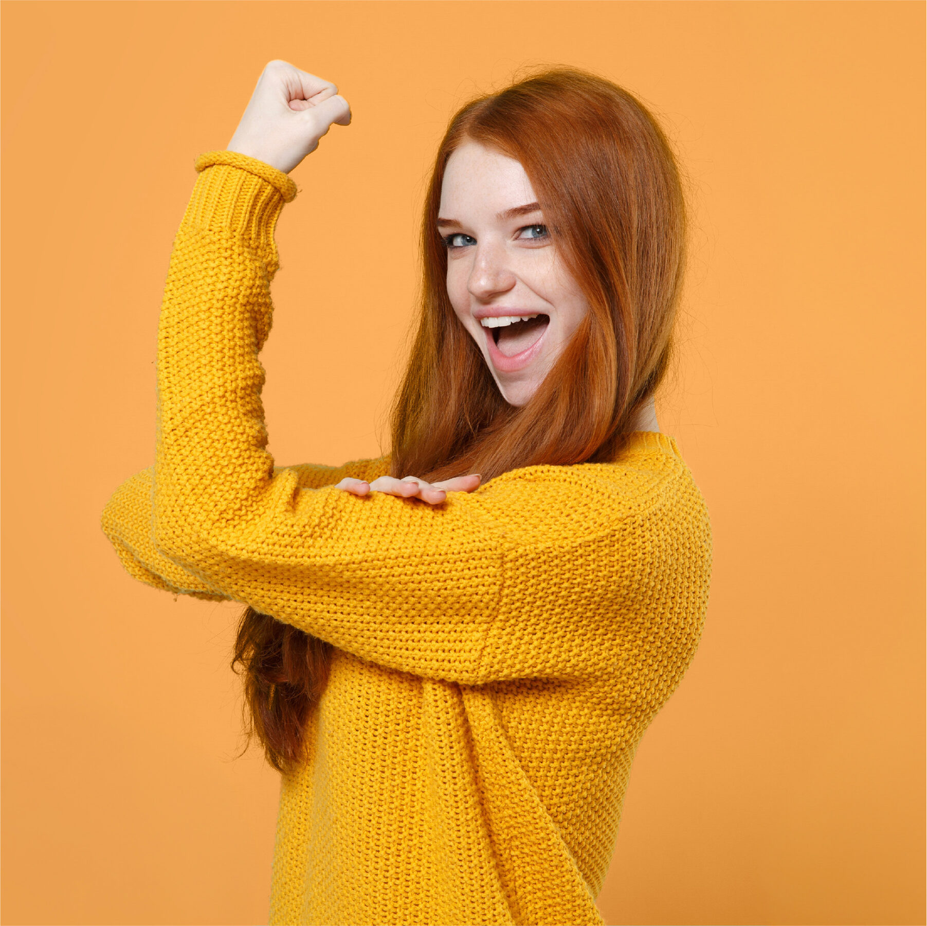 Confident employee with raised arms representing protection